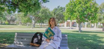 Girl Sitting at Campus