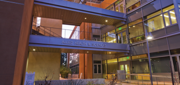 East facing entrance of Allied Health & Sciences Center during sunset