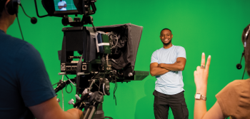 Student in front of camera in TV studio