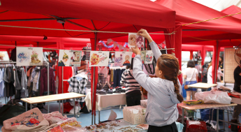Girl displaying artwork under a red pop-up text