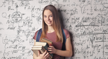 Girl with backpack and books in front a wall of math symbols