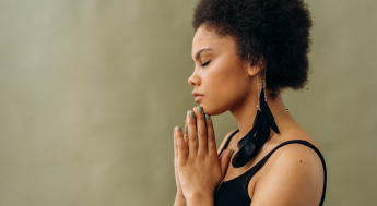 Black female calm doing a yoga pose