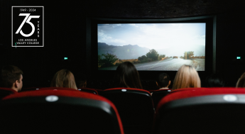Audience watching movie and the LAVC 75th Anniversary logo
