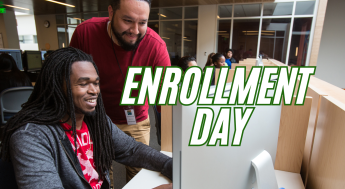 Staff helping a student to enroll online