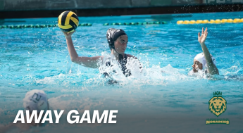 Monarchs Women's Water Polo game scene featuring players on the pool with the text "away game" in the bottom left corner. 