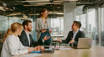 Diverse group of employees talking in a conference room