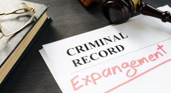 Gavel on table with Criminal Record paperwork for expungement