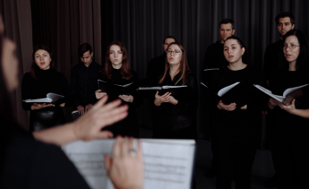 Choir conductor directing choir singers