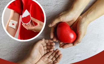 Person that donated blood. Hands passing a red heart.