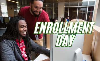 Staff helping a student to enroll online
