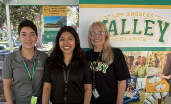 Mosaic Village team tabling for a registration event 