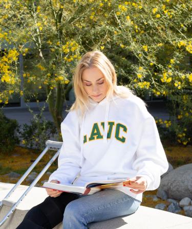 Girl Reading with LAVC Sweatshirt 