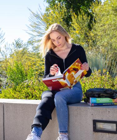 Girl Reading at Campus