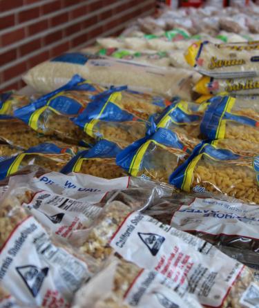 Pasta and rice packets on table