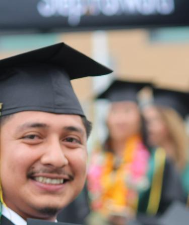 Student in graduation regalia 