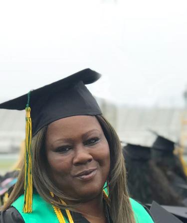 Student in graduation regalia 