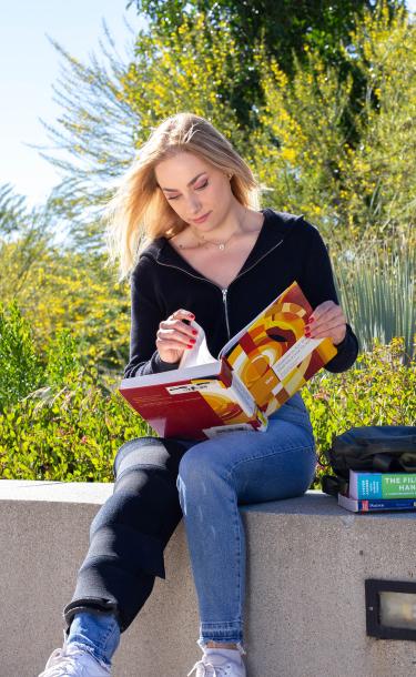 Girl Reading at Campus