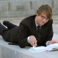 Man Lying Down Studying
