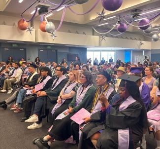 Student graduates seated during lavender graduation 2025