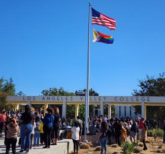 Picture of the Progressive Pride Flag raised at LAVC for National Coming Out Day