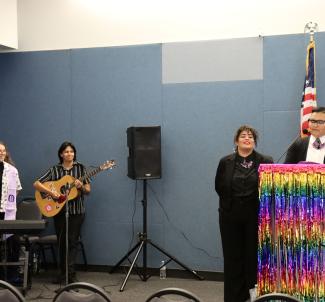 Emcees delivering a speech during Lavender Graduation 2024