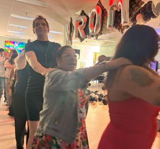 Sutdents doing a conga line for undocuqueer prom 2025