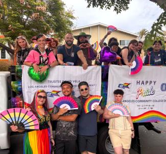 Trustee Hernandez and Trustee Vela posing with students for the West Hollywood Pride Parade