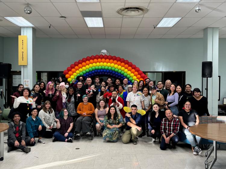 Pride students posing as a group for the annual Holigay Mixer 