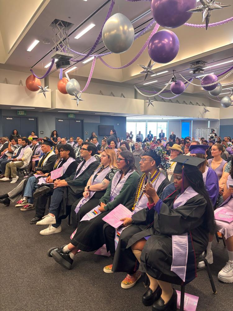 Student graduates seated during lavender graduation 2025