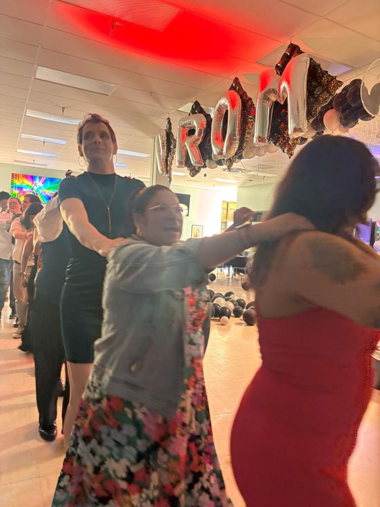 Sutdents doing a conga line for undocuqueer prom 2025