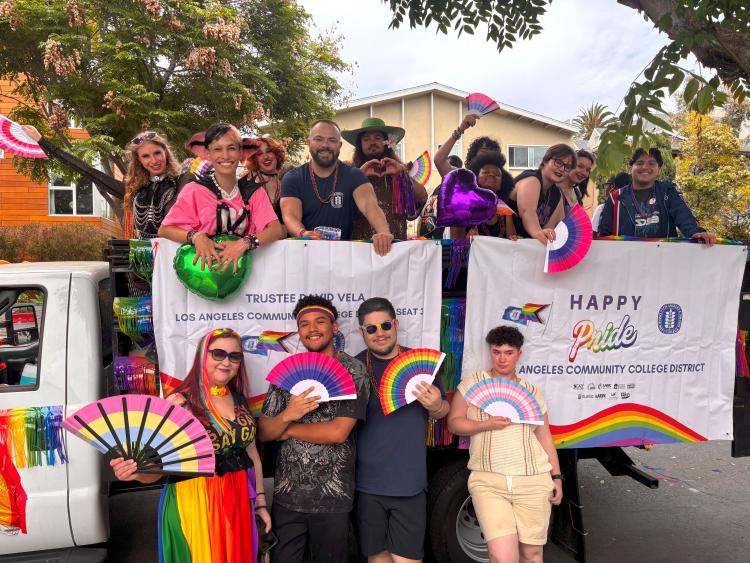 Trustee Hernandez and Trustee Vela posing with students for the West Hollywood Pride Parade