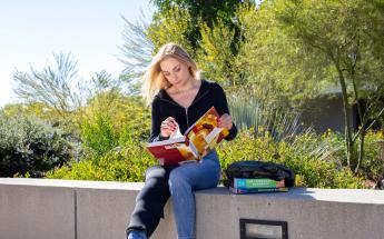 Girl Reading at Campus