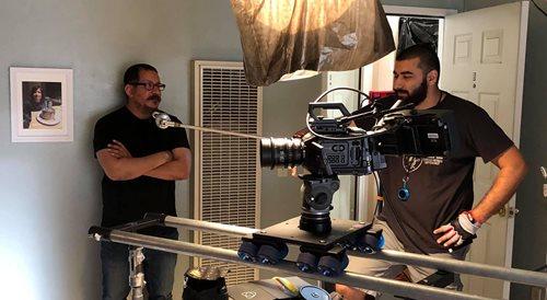 Videographers Positioning Camera