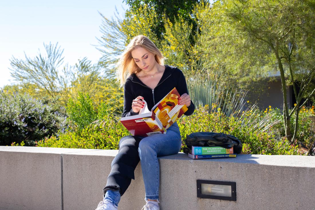 Girl Reading at Campus