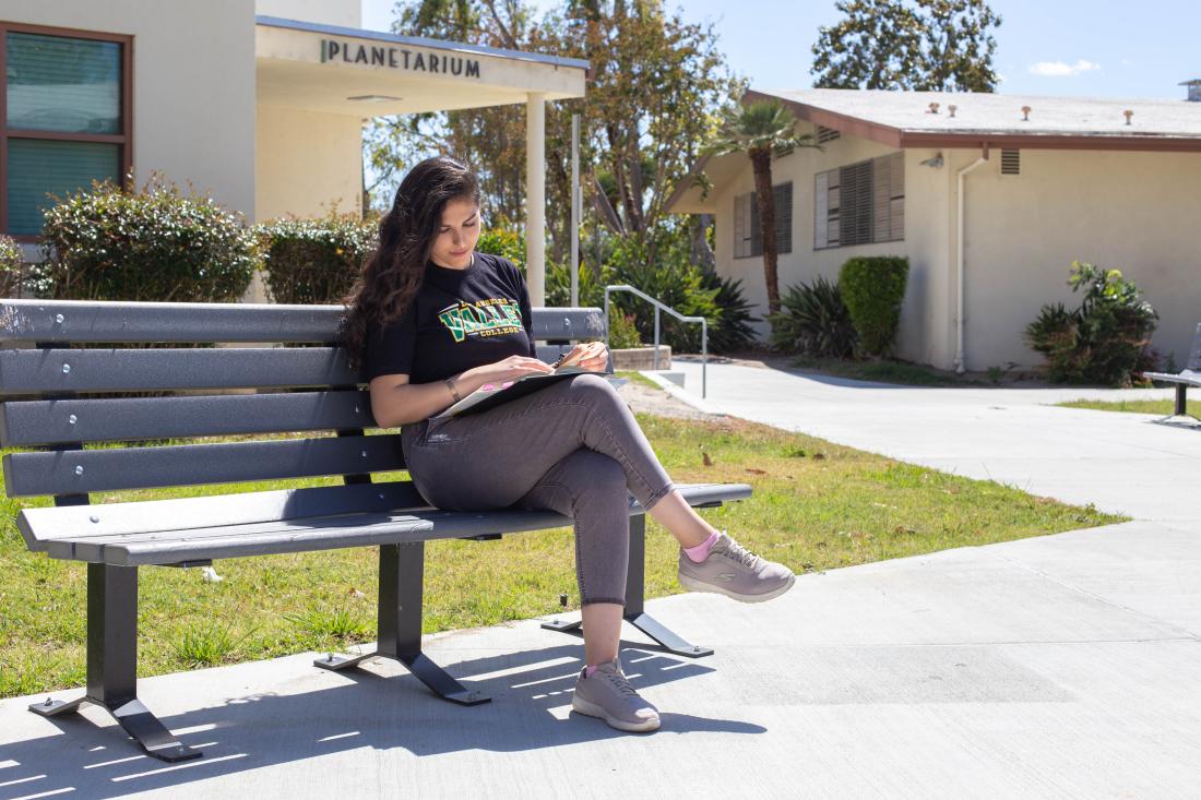 Student Reading Outside the Planetarium