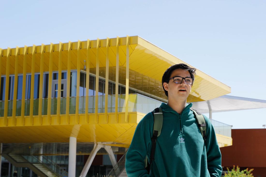 Student Diego Enriquez Standing in Front of Building