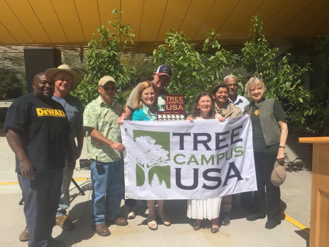 Group of people holding up Banner