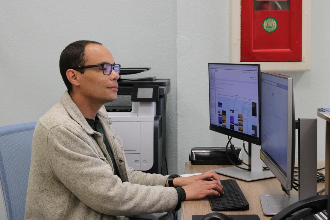 Person sitting in front of a computer