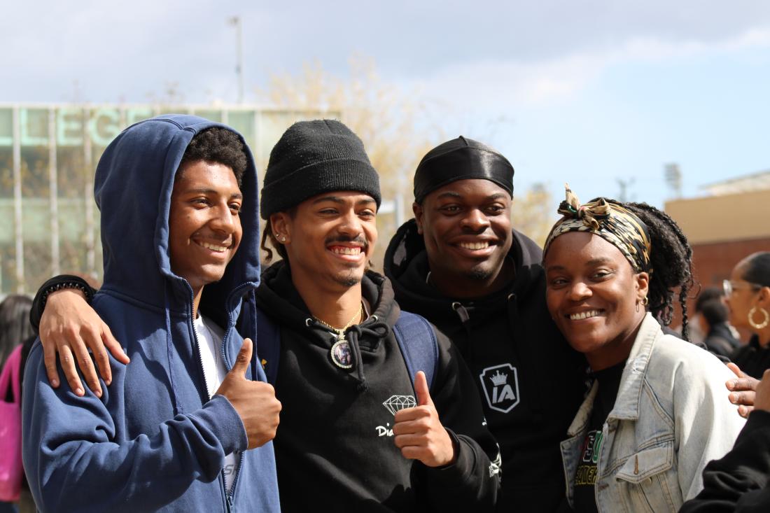 Students smiling and giving thumbs up