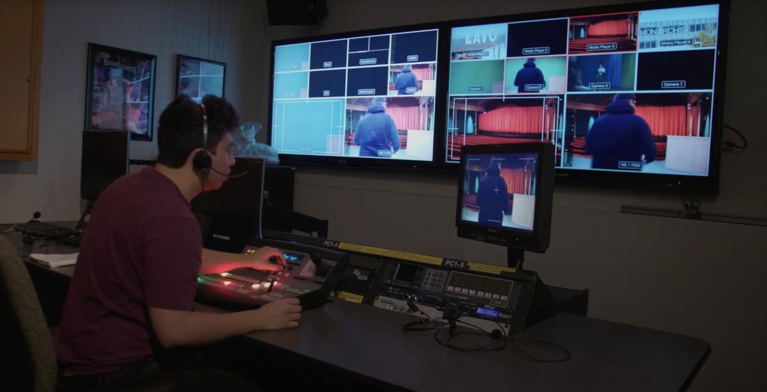 Student working in the control room in the TV Studio