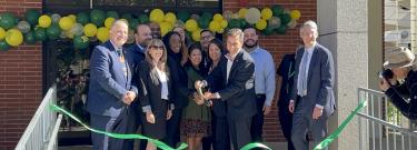 Officials cut the ribbon at the Mosaic Village Opening