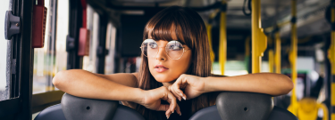 Female sitting inside a bus