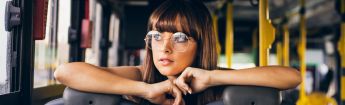 Female sitting inside a bus