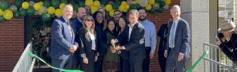 Officials cut the ribbon at the Mosaic Village Opening