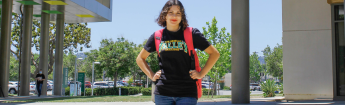 Female student in Valley College shirt with a backpack