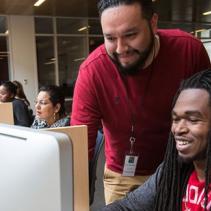 Two Students Looking at Computer