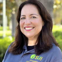 Image of Raquel S.  wearing an ASU Polo with a tree lined background