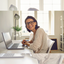 Happy female student on a laptop